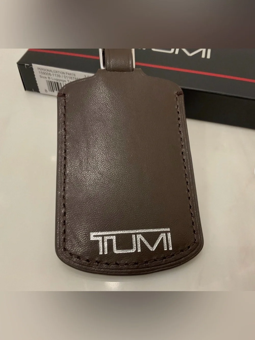 NEW IN BOX - Tumi 3.625” x 2.25” Leather Luggage Name Tag w/ Buckle - BROWN